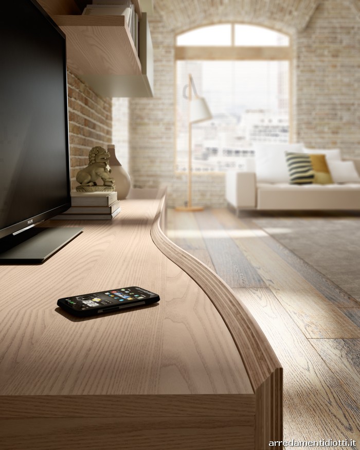 Nel soggiorno il legno diventa un elemento flessibile ...